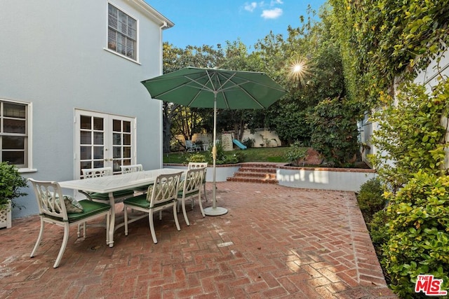 view of patio / terrace featuring french doors and a playground