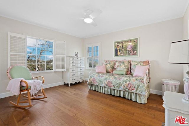 bedroom featuring hardwood / wood-style flooring and ceiling fan