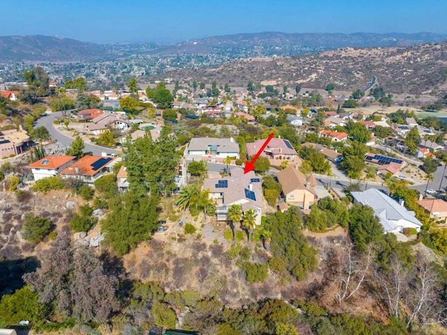 birds eye view of property with a mountain view