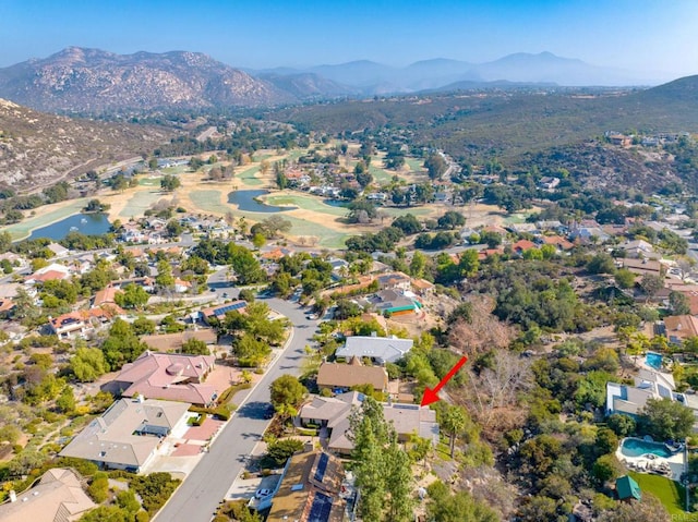 drone / aerial view with a water and mountain view