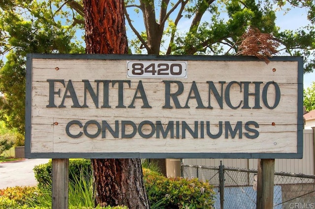 community sign with fence