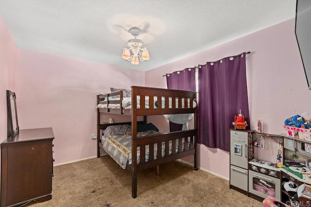 bedroom with carpet flooring, a notable chandelier, a textured ceiling, and baseboards