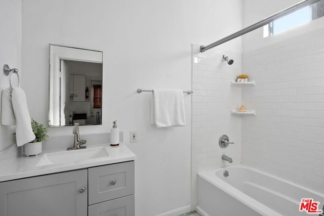 bathroom with vanity and shower / tub combination