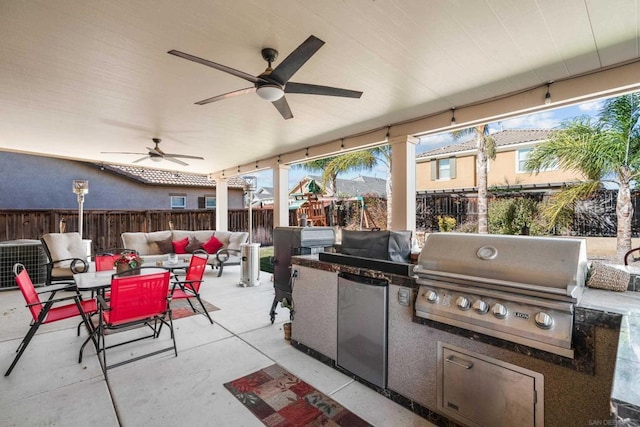 view of patio with a playground, central AC unit, ceiling fan, a grill, and exterior kitchen