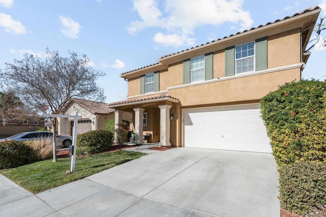 view of front of house featuring a garage and a front yard