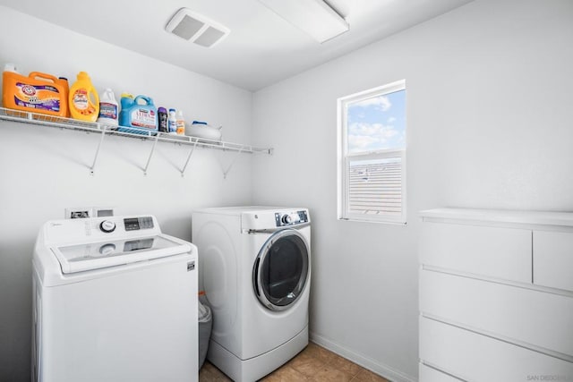 laundry area with washing machine and clothes dryer