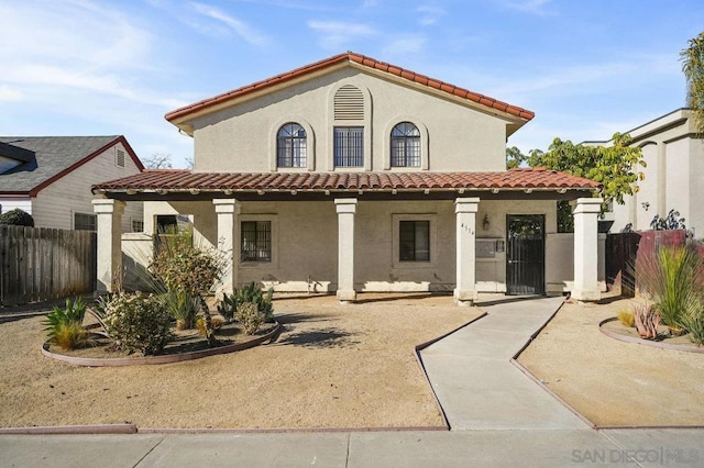 rear view of house with covered porch