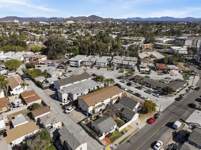 birds eye view of property featuring a mountain view