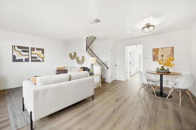 living room with light hardwood / wood-style floors