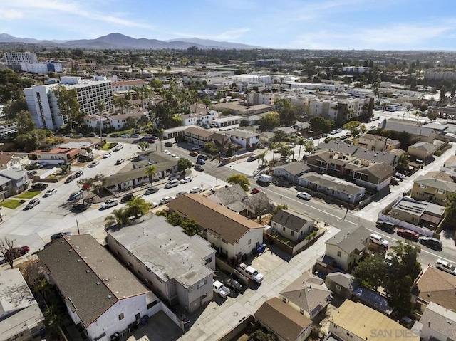 birds eye view of property with a mountain view