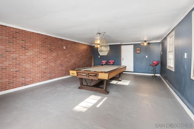 playroom featuring ornamental molding, brick wall, and pool table