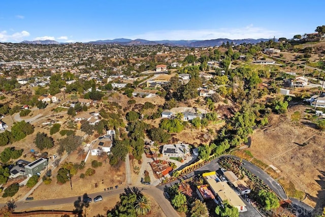 birds eye view of property featuring a mountain view