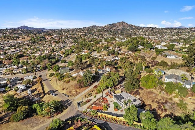 birds eye view of property with a mountain view