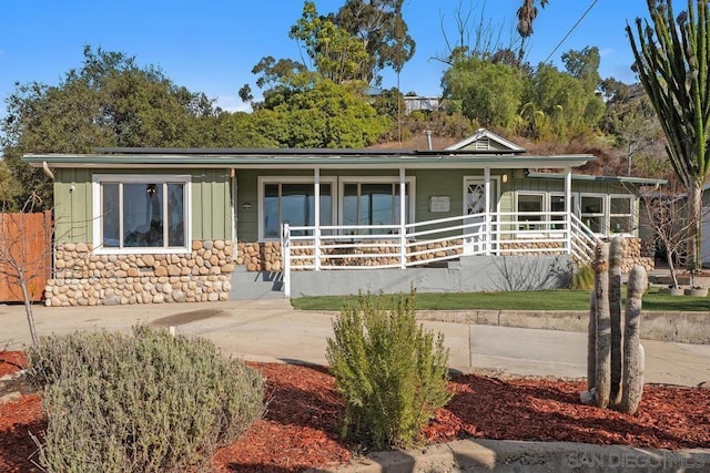 ranch-style home with covered porch