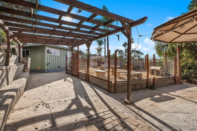 view of patio with a storage shed