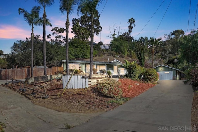 single story home with a garage and a porch