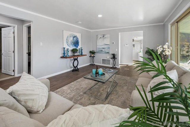 living room with ornamental molding and dark hardwood / wood-style floors