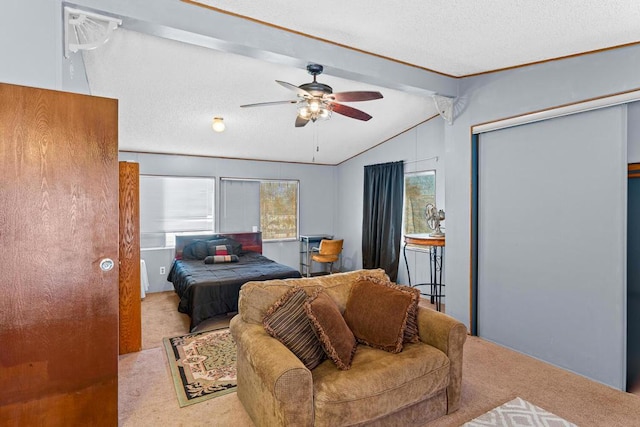 bedroom with multiple windows, vaulted ceiling with beams, light carpet, and ceiling fan