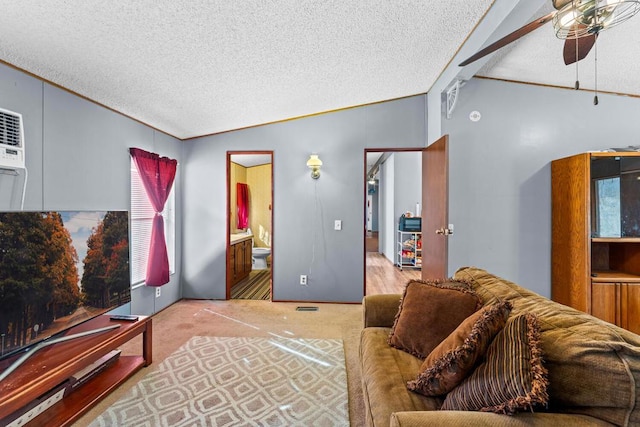 living room with lofted ceiling, ceiling fan, light colored carpet, and a textured ceiling