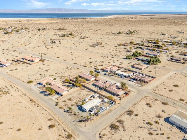 aerial view featuring a view of the beach and a water view