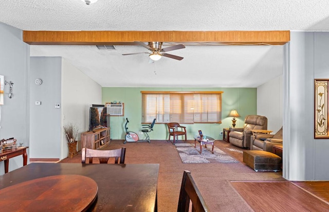 carpeted living room with ceiling fan and a textured ceiling