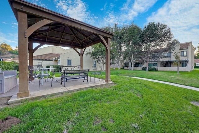 view of community featuring a gazebo, a yard, and a patio area