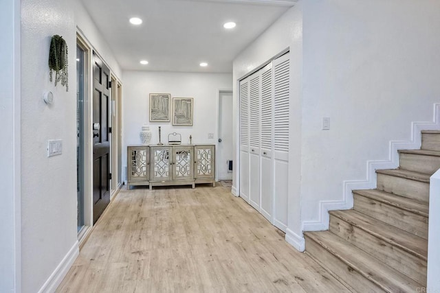 hall with light hardwood / wood-style floors