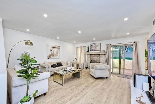 living room with light hardwood / wood-style flooring