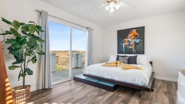 bedroom featuring dark hardwood / wood-style floors, access to outside, and ceiling fan