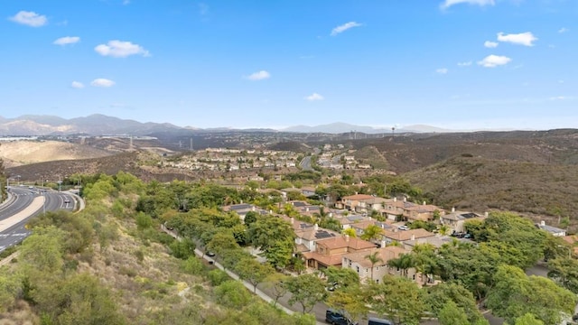 birds eye view of property with a mountain view