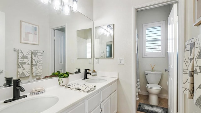 bathroom with walk in shower, vanity, toilet, and tile patterned flooring