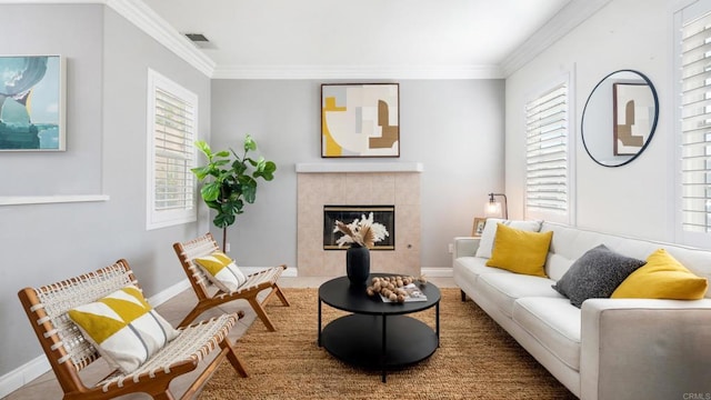 living room featuring ornamental molding and a fireplace