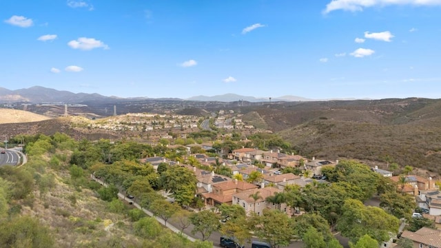 birds eye view of property featuring a mountain view