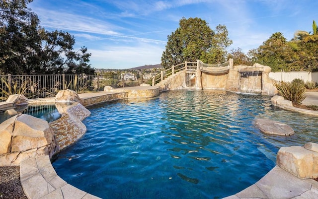 view of pool with pool water feature