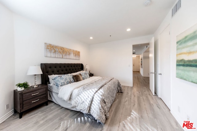 bedroom featuring light hardwood / wood-style floors