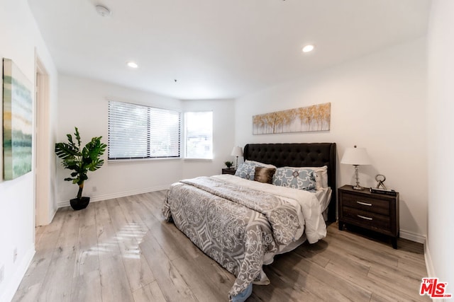 bedroom with light hardwood / wood-style flooring