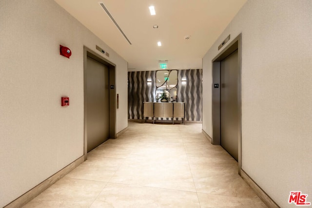 hallway featuring elevator