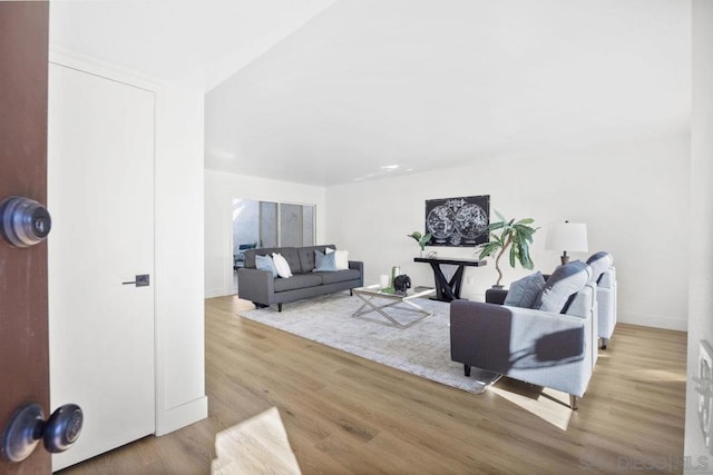 living room with light hardwood / wood-style floors