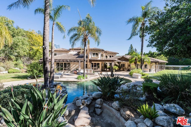 rear view of house with a patio