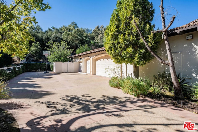 view of side of property with a garage