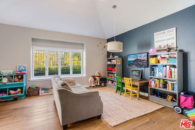 rec room with lofted ceiling and light wood-type flooring