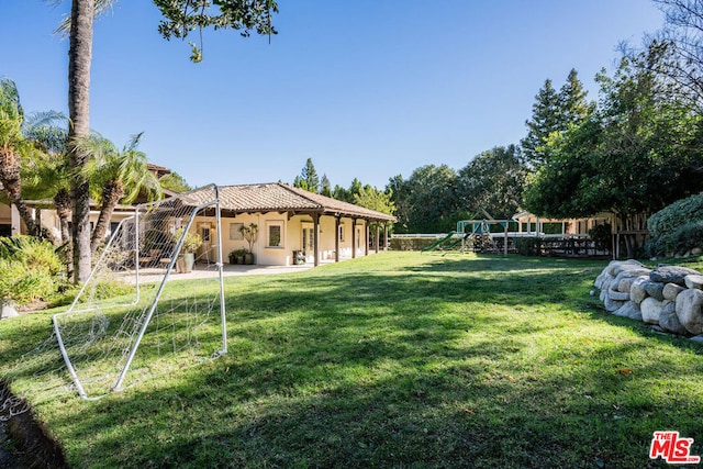 view of yard featuring a playground