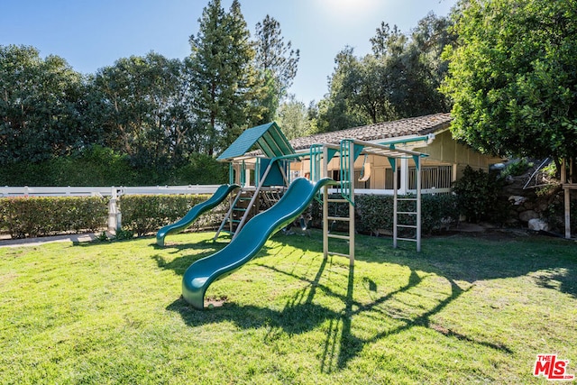 view of playground with a yard