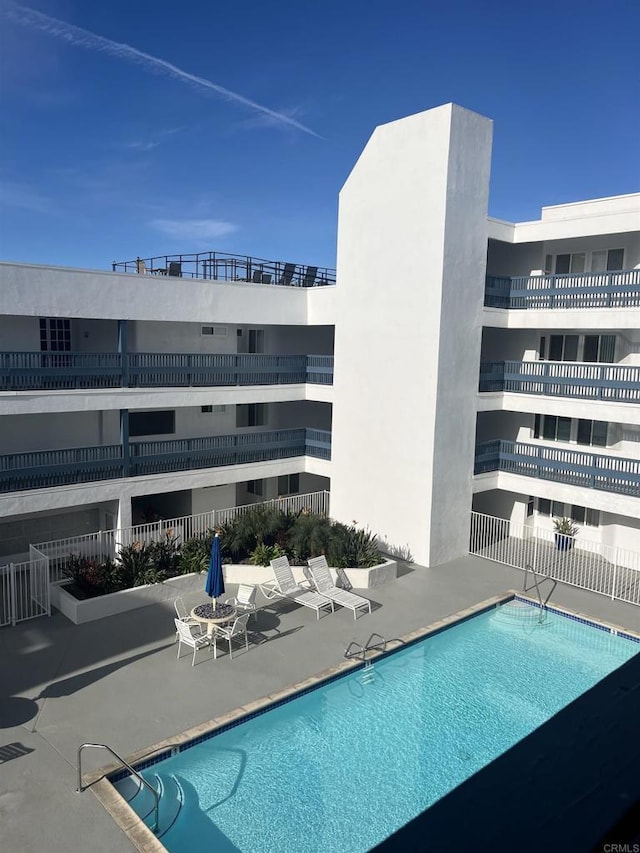 view of pool featuring a patio area