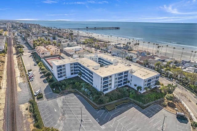 birds eye view of property featuring a water view and a view of the beach