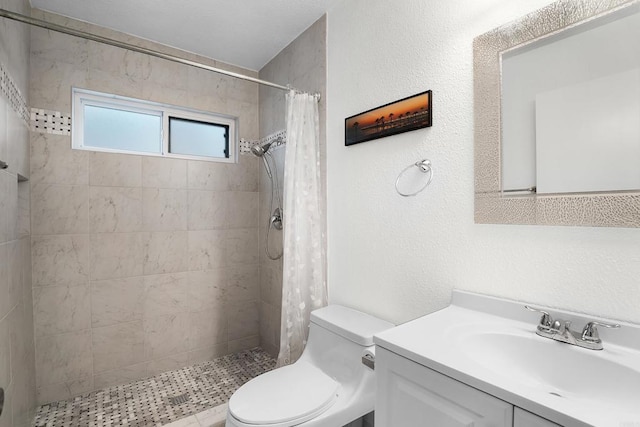 910 N Pacific St Unit 41, Oceanside, CA 92054 - bathroom featuring vanity, toilet, and a tile shower
