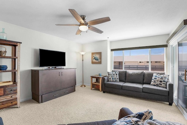 910 N Pacific St Unit 41, Oceanside, CA 92054 - living room featuring a ceiling fan, light carpet, and baseboards