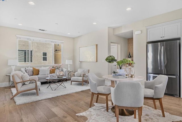 dining space featuring light hardwood / wood-style flooring