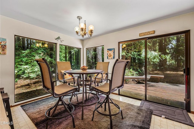 dining space with a chandelier