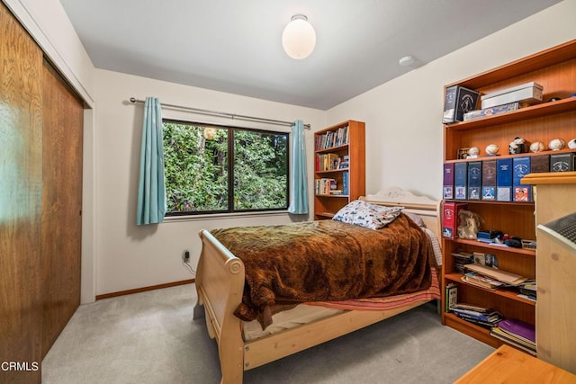 carpeted bedroom with a closet